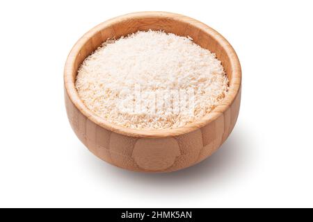 Coconut flakes in wooden bowl isolated on white background. Stock Photo