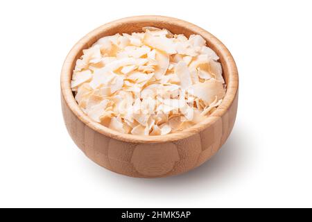 Coconut chips in wooden bowl, isolated on white background Stock Photo