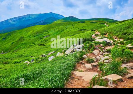 Hike the rocky path, leading along the steep mountain slopes to the Mount Pip Ivan, also famous as the White Elephant and located in Chornohora Mounta Stock Photo