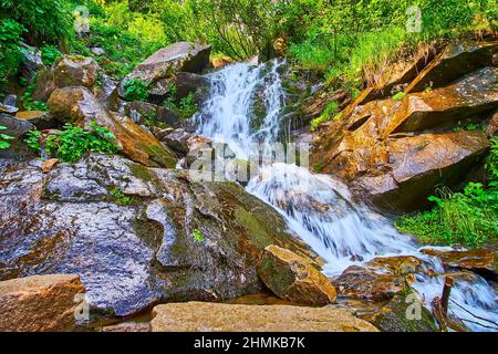 The picturesque view of the talus scree slope with jets of the Smotrych Falls, Dzembronia, Carpathian mountains, Ukraine