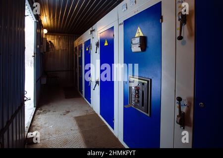 Transformer box. Locked metal doors of switchgear cabinets. Stock Photo