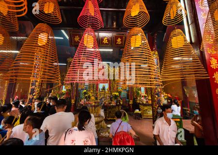 China round incense are burning inside the Ong temple in Can Tho Stock Photo