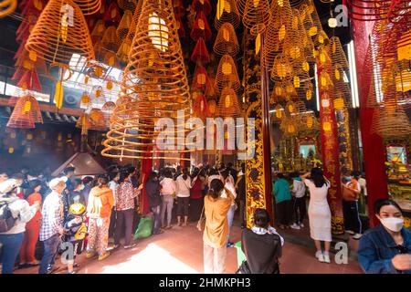 China round incense are burning inside the Ong temple in Can Tho Stock Photo