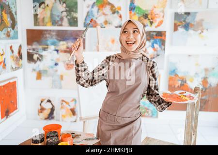 muslim artist painter thinking about what to paint Stock Photo