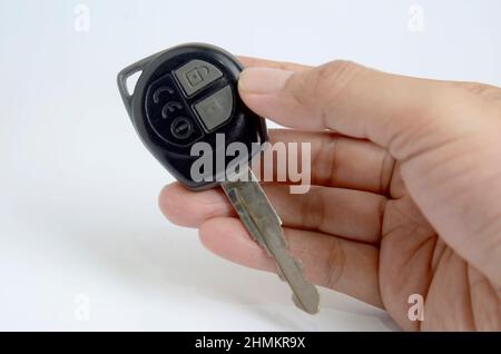 hand holding car key. Immobilizer. Isolated in White background Stock Photo