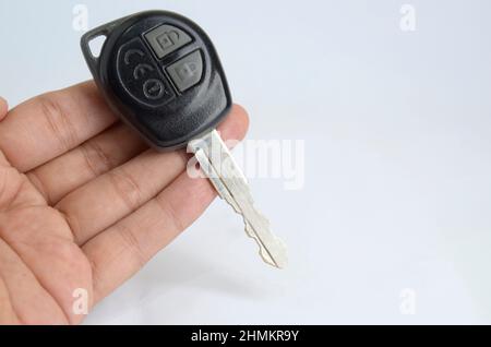 hand holding car key. Immobilizer. Isolated in White background Stock Photo