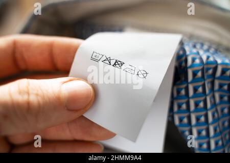 Synthetic Clothes Washing And Laundry Label Instructions Tag Stock Photo