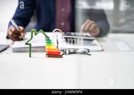 Energy Efficient House Audit Using Calculator. High Efficiency Stock Photo