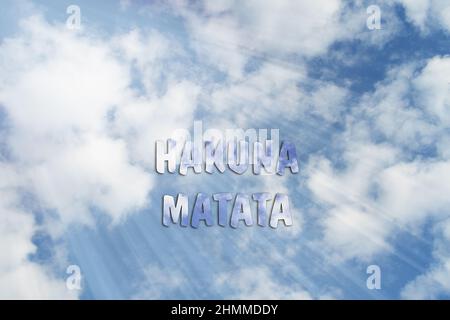 Hakuna Matata, Swahili phrase it means no worries. Motivational positive quote. Slogan, inspirational optimistic phrase against serene blue sky. Stock Photo