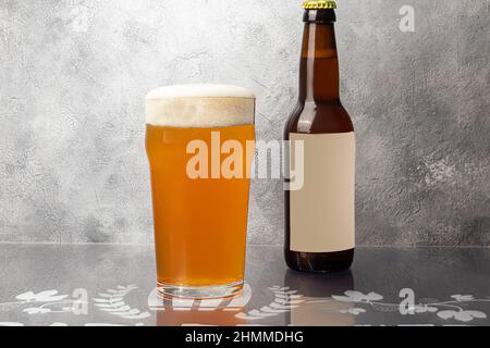 Glasses with different types of craft beer on a wooden bar. In glasses and bottles. Nuts and crackers on the table. On a dark background. copy space Stock Photo