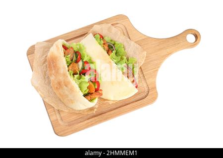 Board with pitas with chicken isolated on white background Stock Photo