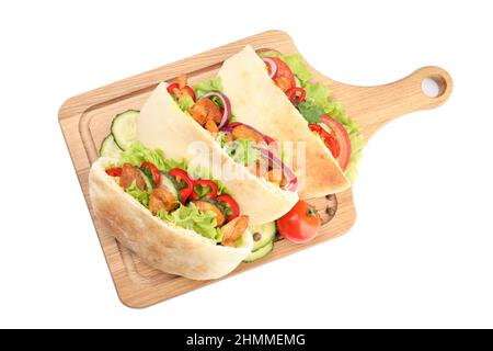 Board with pitas with chicken isolated on white background Stock Photo