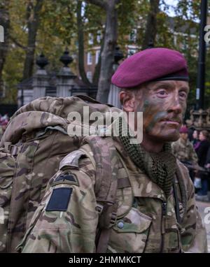 Man from 53 B Company 4th Battalion The Parachute Regiment in combat gear & painted face marches in the Lord Mayor’s show 2021, London. Stock Photo