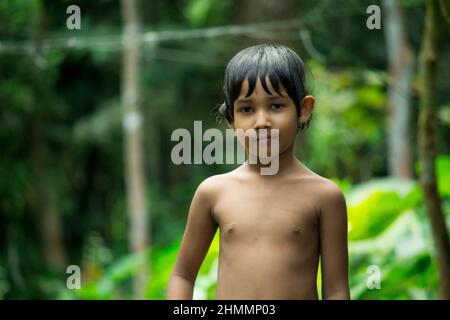 03-Oct-2021, Barisal, Bangladesh. Little baby on a green background Stock Photo