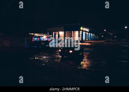 Red and white lights from passing cars. Night highway. Stock Photo