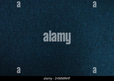 Dark blue glitter cardboard texture. Navy blue color texture with light. Stock Photo
