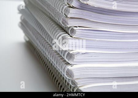 stack of large white notebooks on the desktop close up Stock Photo