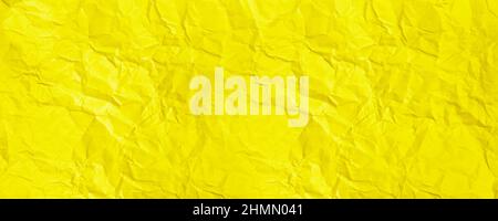 Crumpled Paper Texture. Abstract Yellow Background Stock Photo