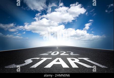 New year 2022 or start concept.Word 2022 written on the road in asphalt road