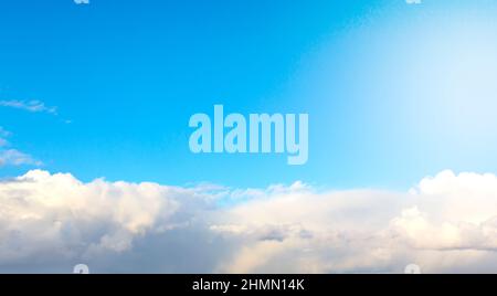 The sky is large, bright, beautiful and has white clouds. Stock Photo