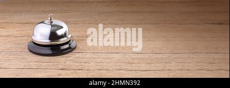 Hotel service bell on a wooden table Concept hotel, travel, room Stock Photo