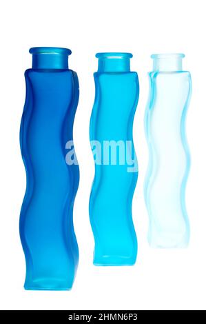 Blue bottles. Note that only the front one is in focus. Stock Photo