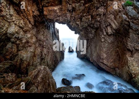 'Mui Vi Rong' with a rock cave connecting to the sea, a wild beauty in Tan Phung Fishing Village, Phu My, Binh Dinh, Vietnam Stock Photo