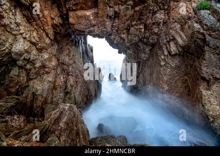 'Mui Vi Rong' with a rock cave connecting to the sea, a wild beauty in Tan Phung Fishing Village, Phu My, Binh Dinh, Vietnam Stock Photo