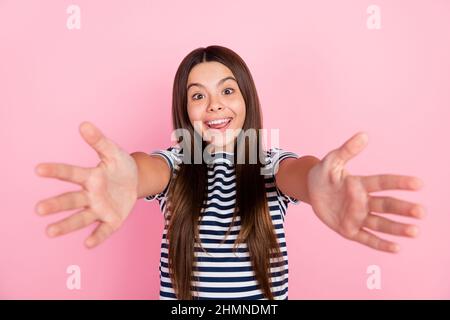 Photo of cute friendly girl dressed striped clothes open arm ready hug you isolated pink color background Stock Photo