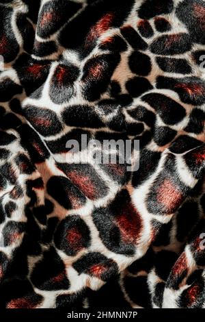 closeup of a draped animal print fabric, to be used as a background Stock Photo