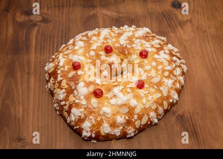 Top view of freshly baked roscón de reyes on kneading table, with copy space Stock Photo