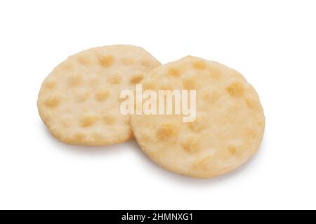 Studio shot of rice crackers cut out against a white background - John Gollop Stock Photo