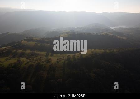 Late afternoon sunlight illuminates the beautiful hills and valleys found in Livermore, California. This area is not far east of San Francisco Bay. Stock Photo