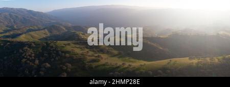 Late afternoon sunlight illuminates the beautiful hills and valleys found in Livermore, California. This area is not far east of San Francisco Bay. Stock Photo