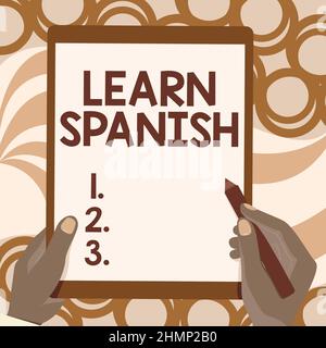 Text caption presenting Learn Spanish. Business overview Translation Language in Spain Vocabulary Dialect Speech Drawing Of Both Hands Holding Tablet Stock Photo