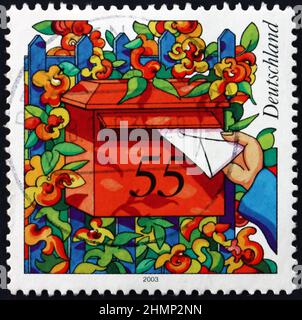 GERMANY - CIRCA 2003: a stamp printed in Germany shows mailbox, circa 2003 Stock Photo
