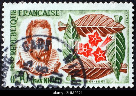 FRANCE - CIRCA 1961: a stamp printed in France shows Jean Nicot, was a French diplomat and scholar, famous for being the first to bring tobacco to Fra Stock Photo