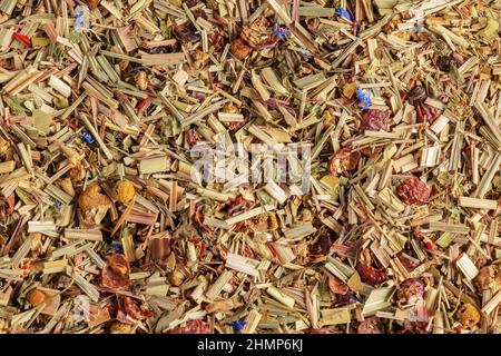 Alpine meadow herbal tea texture background. Mix tea with dried fruits and dried flowers. Tea background. Stock Photo