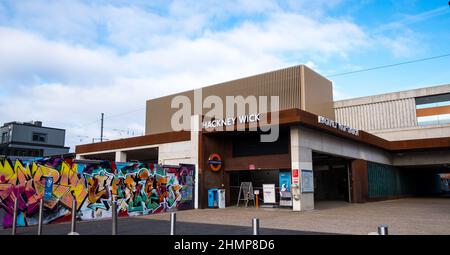 Front entrance to Hackney Wick overground station with graffiti wall Stock Photo