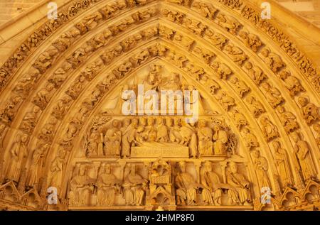 PARIS, FRANCE - JUNE 15. 2011: The detail from side portal of Notre-Dame cathedral  - Coronatiopn of Virgin Mary at night