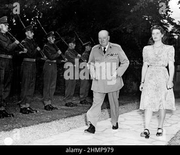 British Prime Minister Winston Churchill and his daughter, Mary, walk in the garden of their residence during the Potsdam Conference in Germany. Stock Photo