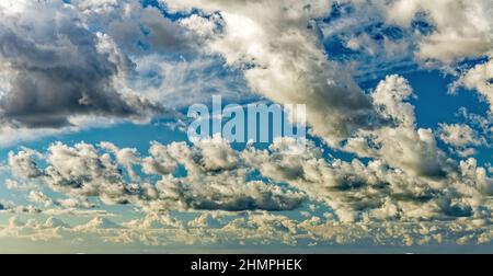 Dramatic colorful sunset sky Background with clouds and sunlight . Soft focus. Stock Photo