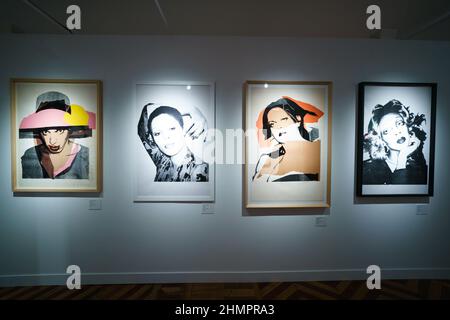 Madrid, Spain. 11th Feb, 2022. View of the paintings at the wall at Palacio de Santa Bárbara, during the exhibition.The exhibition by Next Exhibition Company, takes a historical and professional tour of the artist Andy Warhol, a journey through America in the 50s, 60s and 70s. With the participation of Art Motors and the support of the Italian Chamber of Commerce, the exhibition will be open to the public from February 12 to June 5. Credit: SOPA Images Limited/Alamy Live News Stock Photo