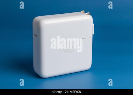 Manila, Philippines - February 12, 2022: Apple MacBook Pro and Isolated in Blue Background Stock Photo