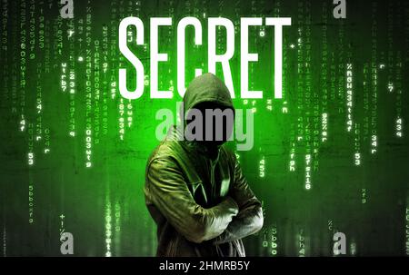 Faceless hacker with inscription Stock Photo