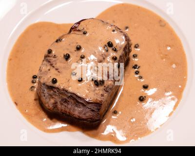 Tenderloin Steak with Green Pepper Sauce or Filet Mignon and Sauce Pouvre Vert Stock Photo