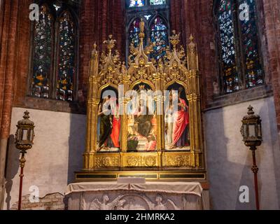 Venice, Italy - January 4 2022: Corner Chapel Altar Triptych at Santa Maria Gloriosa dei Frari Church Stock Photo