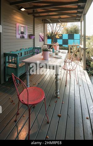 Appeltern, Netherlands, September 29, 2017: Set table on the porch of a gazebo Stock Photo