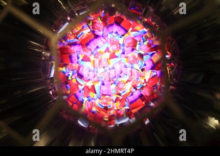 View of glowing colorful kaleidoscope as background Stock Photo