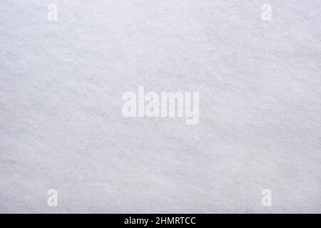 The smooth surface of the white first snow Stock Photo